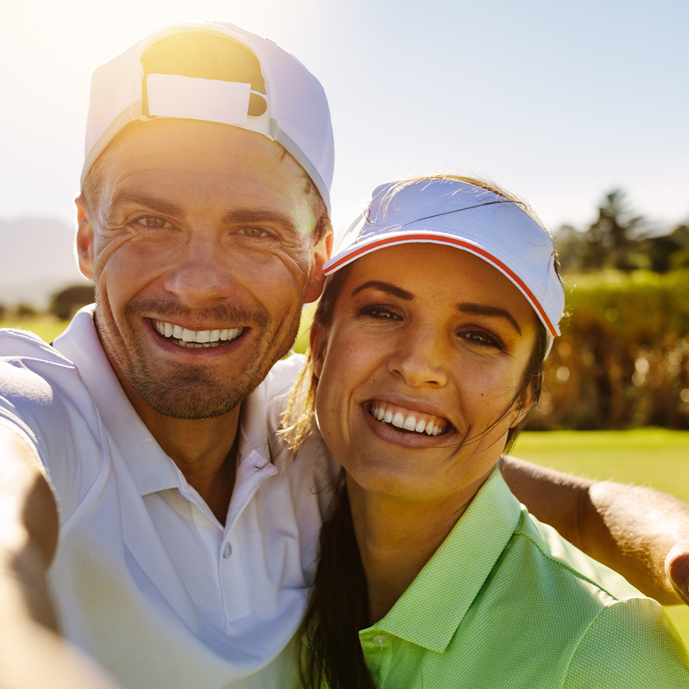 couple golfing and taking a selfie